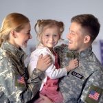 smiling-couple-american-soldiers-holding-daughter-rejoicing-homecoming-duty-stock-photo-smiling-couple-american-soldiers-156632255